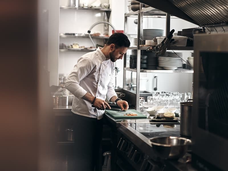 Chef plating in the open kitchen